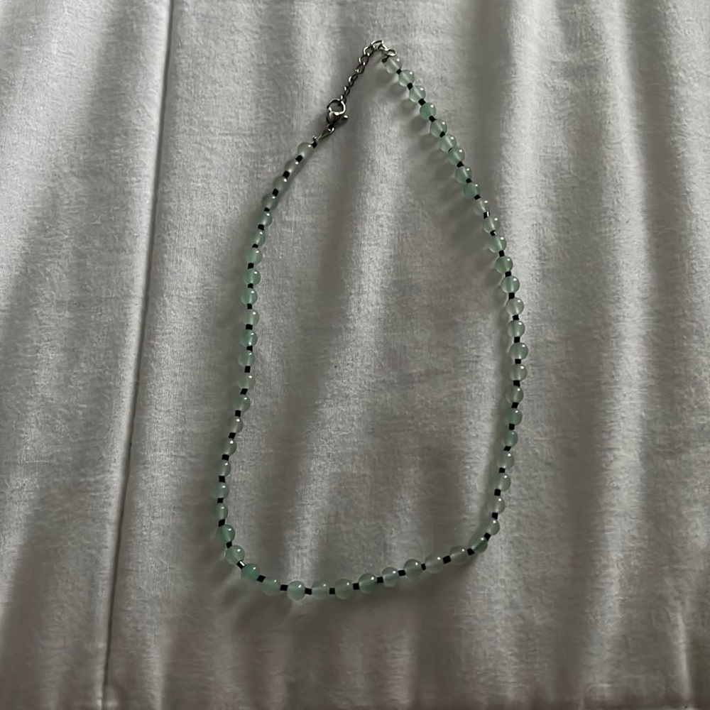 green and black beaded necklace
